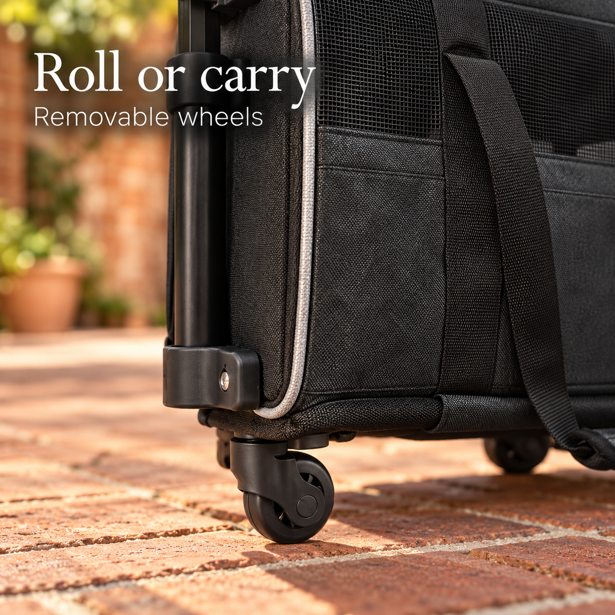 Removable wheel detail on black pet carrier