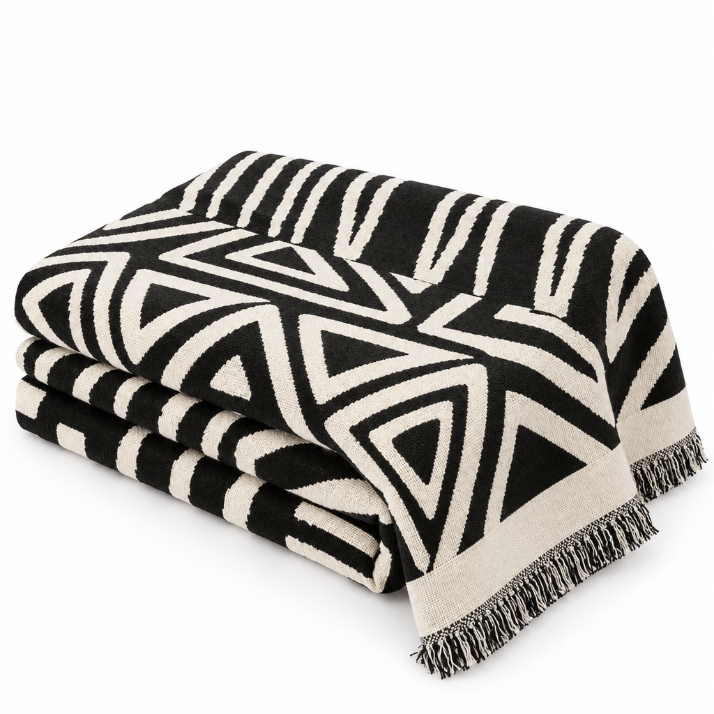 Folded geometric sofa throw on white