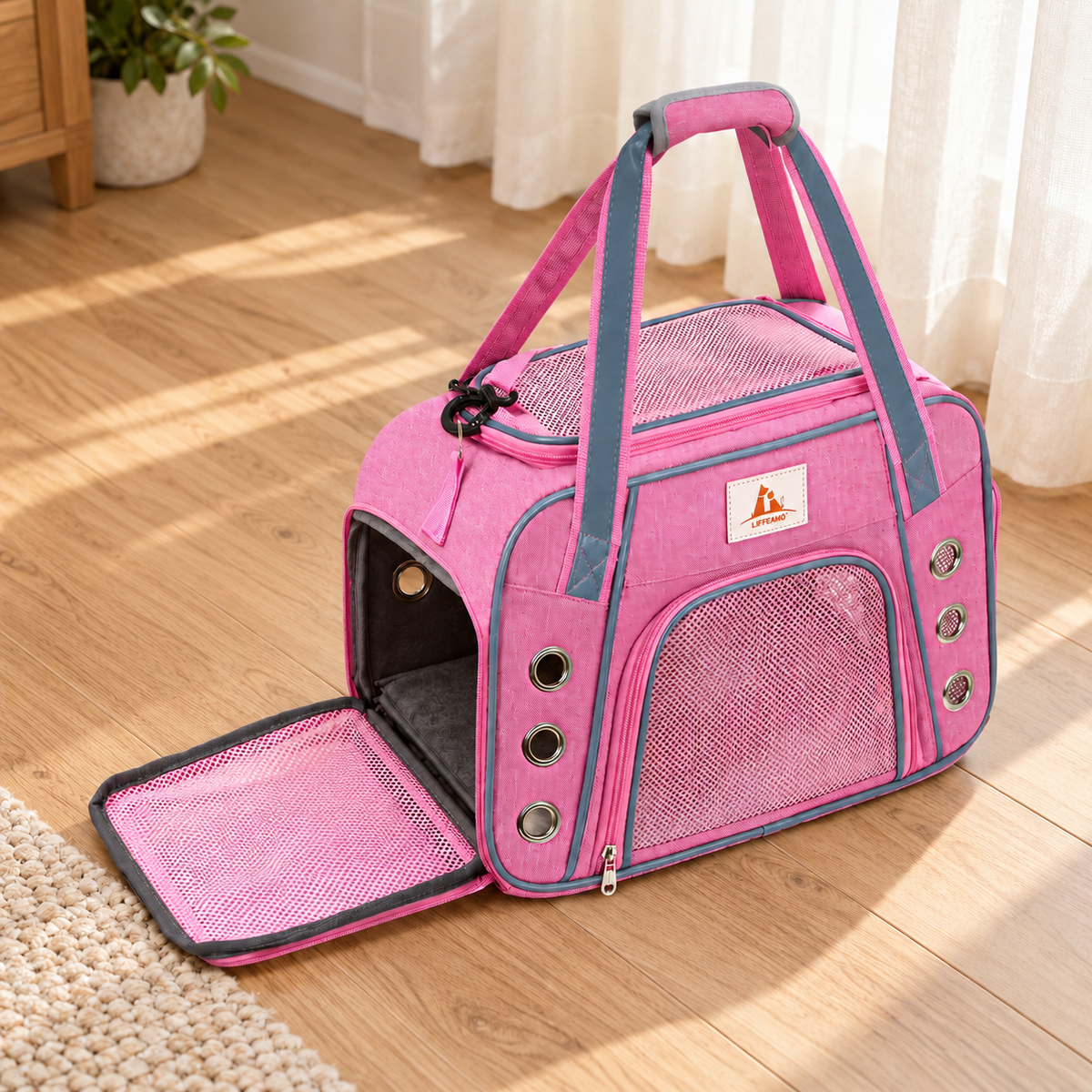 pink carrier with grey trim and circular metal ventilation holes – empty product view