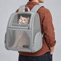 grey FERMAO mesh backpack – carried by model in studio