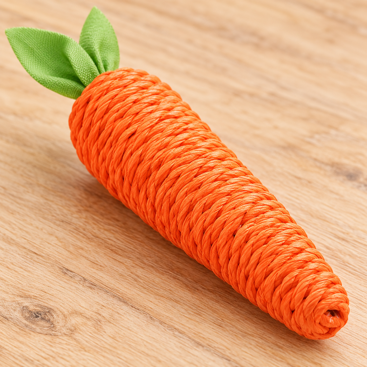 Close-up of orange paper-rope texture and green fabric leaves