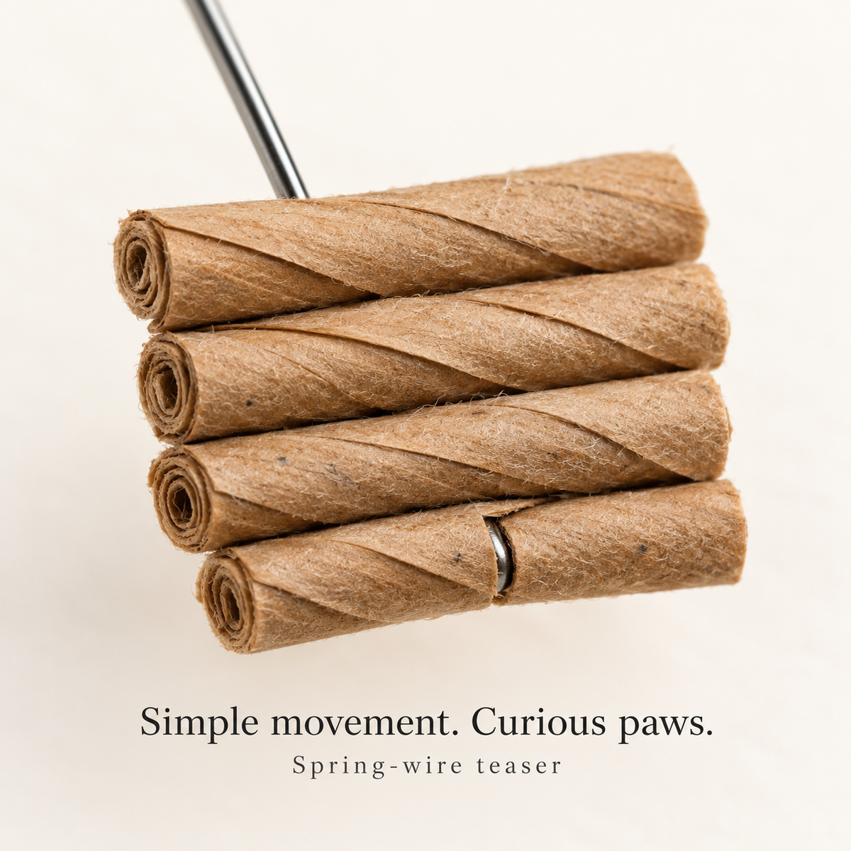 Cat Dancer rolled paper teaser and spring wire close-up