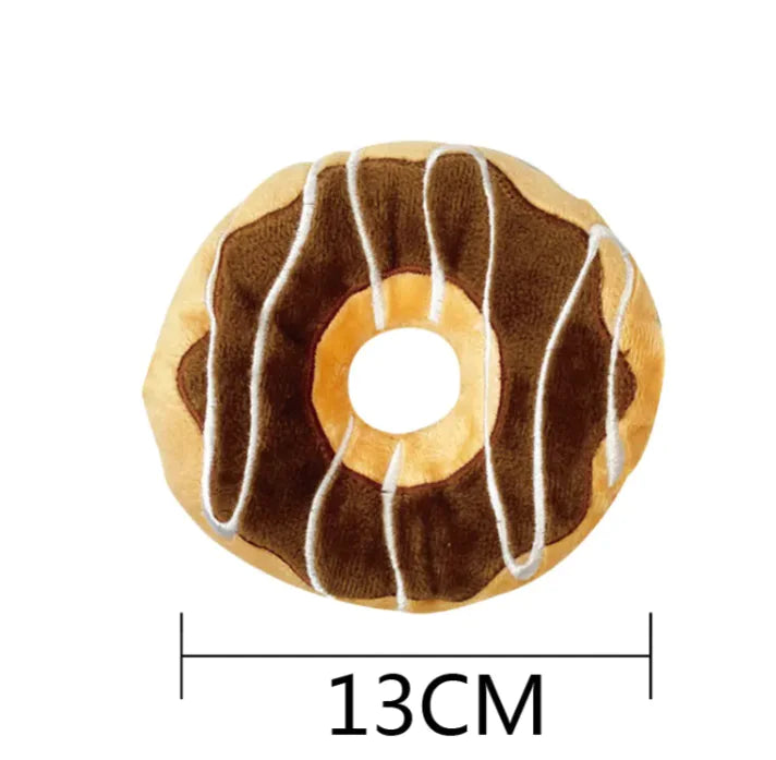Chocolate-brown donut plush dog toy with white drizzle, supplier-listed diameter 13 cm