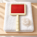 Universal Slicker Dog Grooming Brush – Small in a practical grooming setting without people