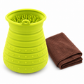 Green silicone paw-cleaning cup and brown towel