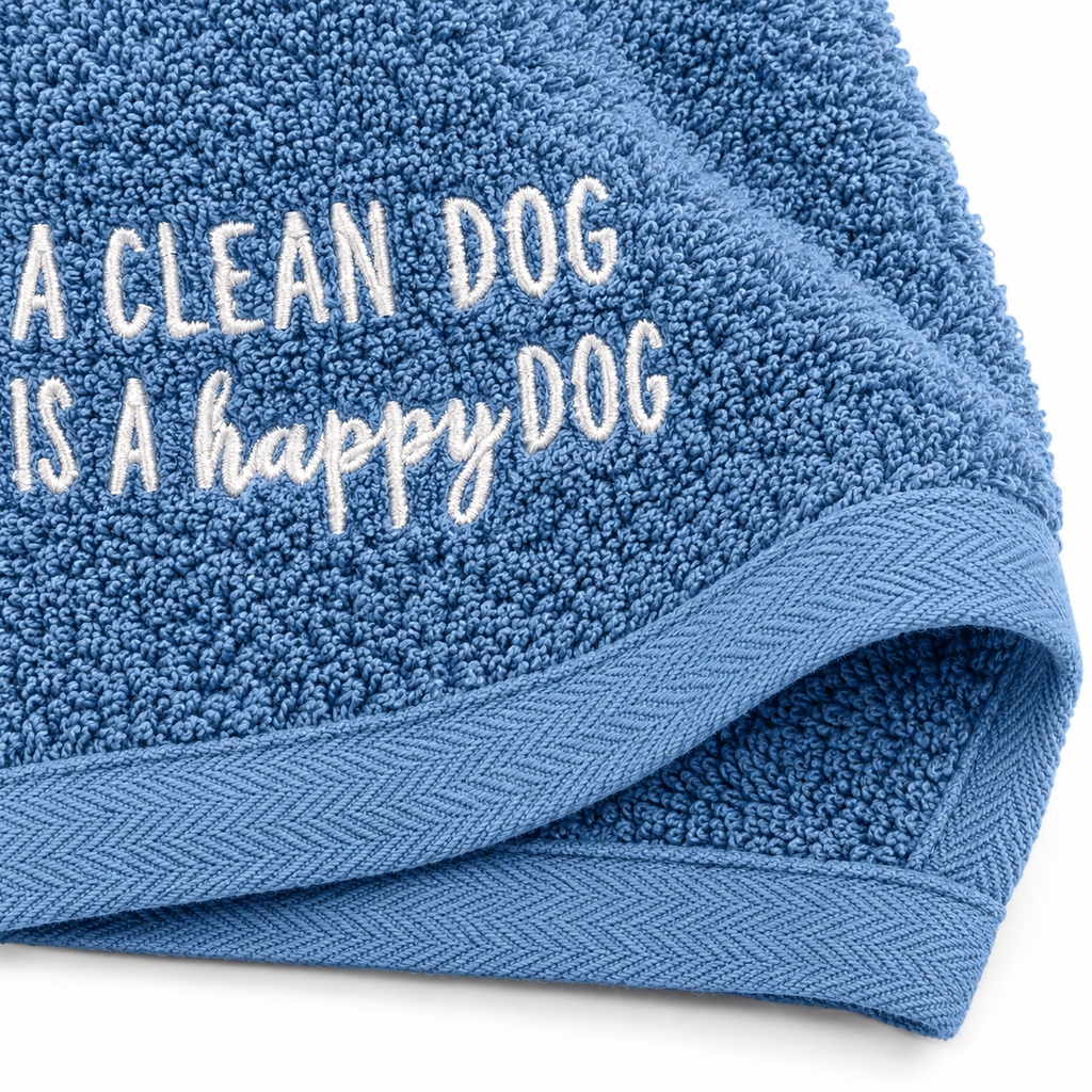 Detail of blue cotton terry loops, embroidered text and woven border
