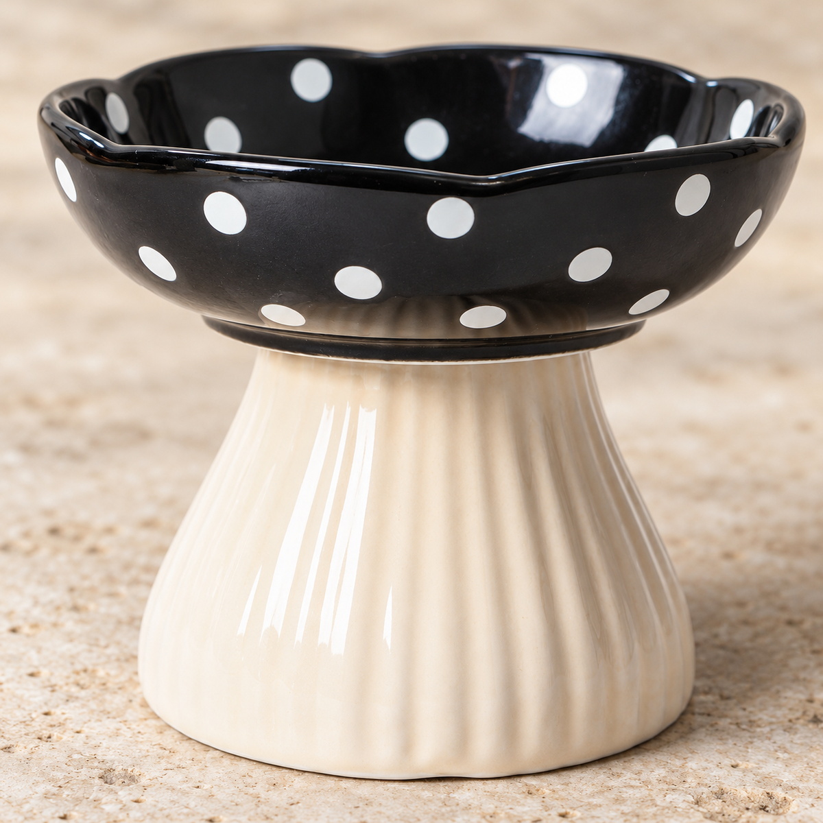 Close-up of the polka-dot rim and fluted cream pedestal