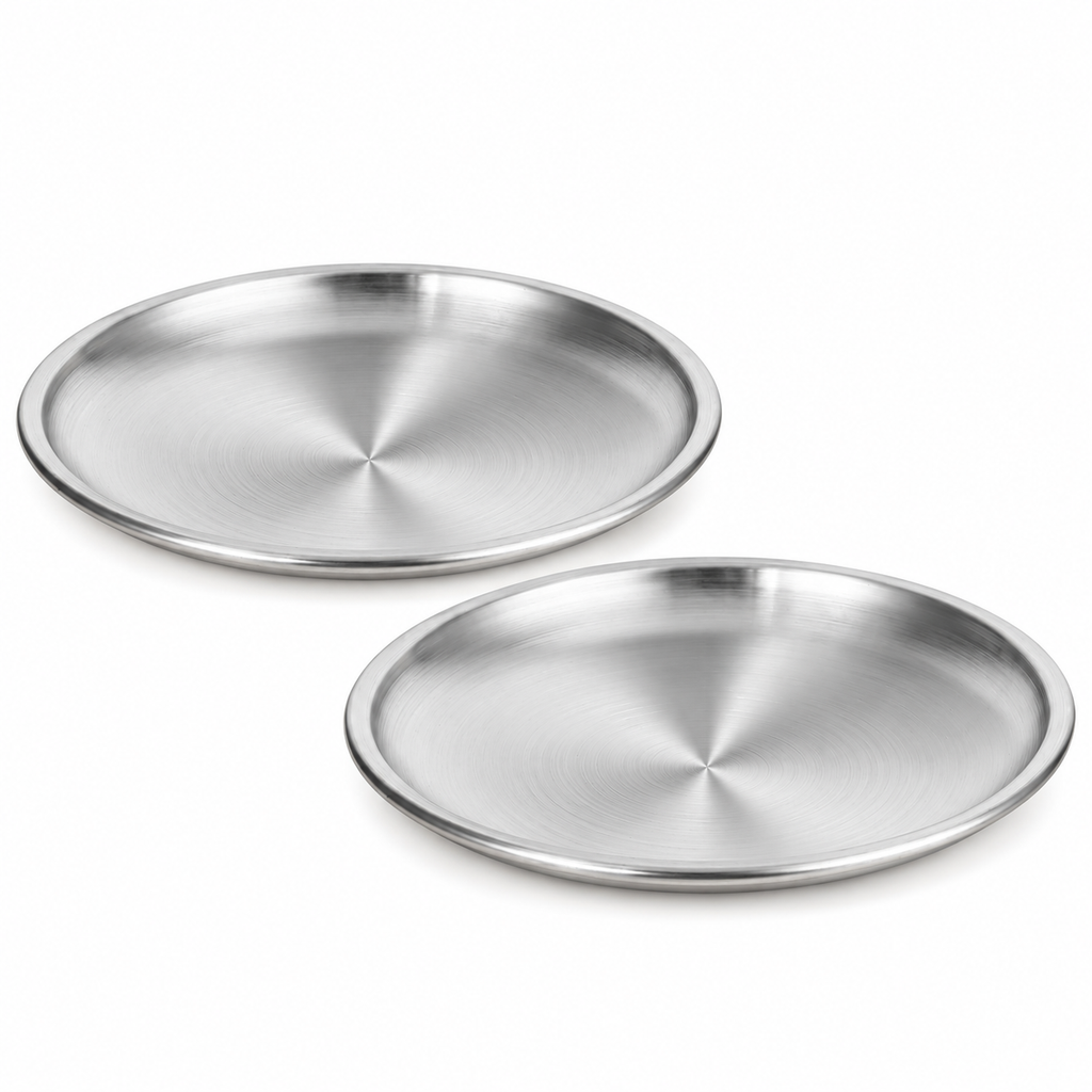 Two shallow stainless steel cat dishes on white