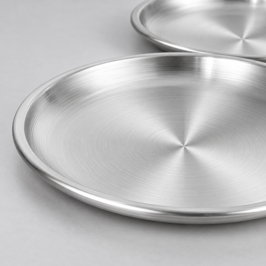 Close-up of the shallow rounded rim and brushed steel surface