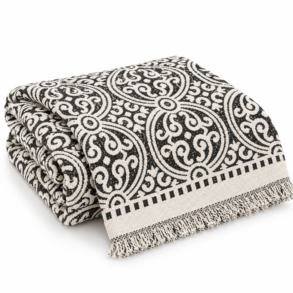 Folded medallion throw cover on white