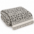 Folded medallion throw cover on white