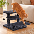 Orange tabby using smoky grey three-step Furcato cat stairs beside a sofa
