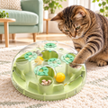 Tabby cat reaching into green puzzle orb