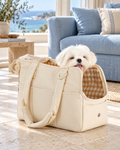 ONECUTE beige cotton pet tote with white Maltese in a coastal apartment