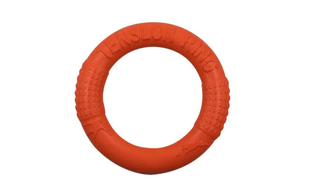 Orange 27.5 cm dog training ring with raised grip texture on a white background