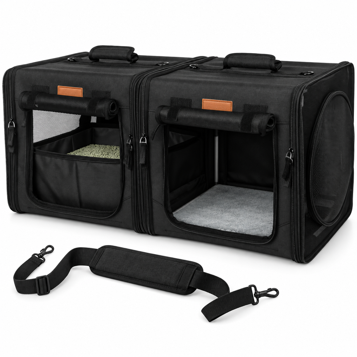 Empty black twin-compartment carrier and shoulder strap on white