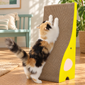 TanoFalo Elephant-Shaped Reversible Cardboard Cat Scratcher with Catnip – Yellow – cat and product in a home setting