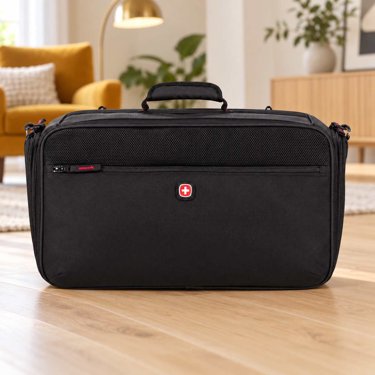 Empty black SwissGear carrier in a living room
